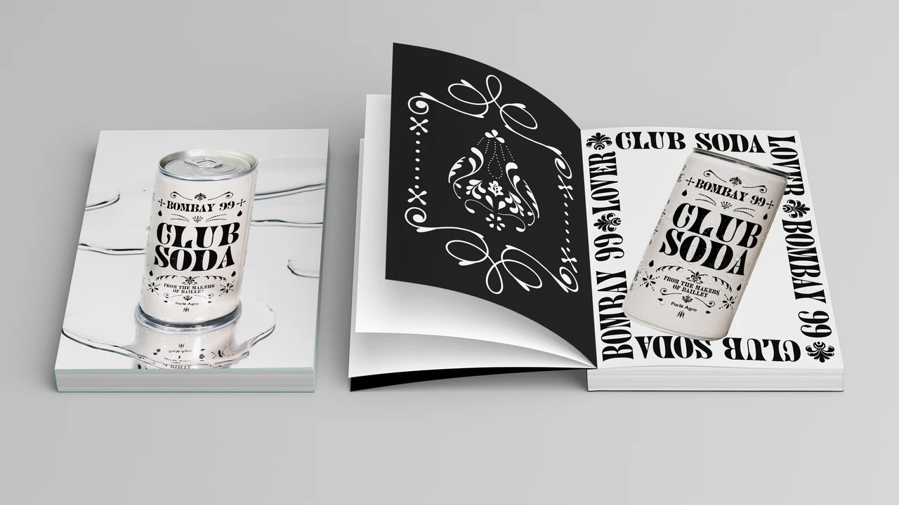 Open and closed publications show a Club Soda can, a black page with white ornaments and an editorial layout with lettering surrounding the product.