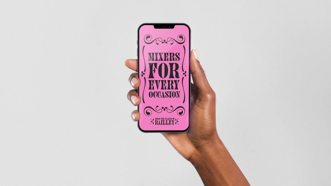 Hand holds a phone displaying a pink Mixers for every occasion graphic surrounded by black ornaments and a Bombay 99 signature.