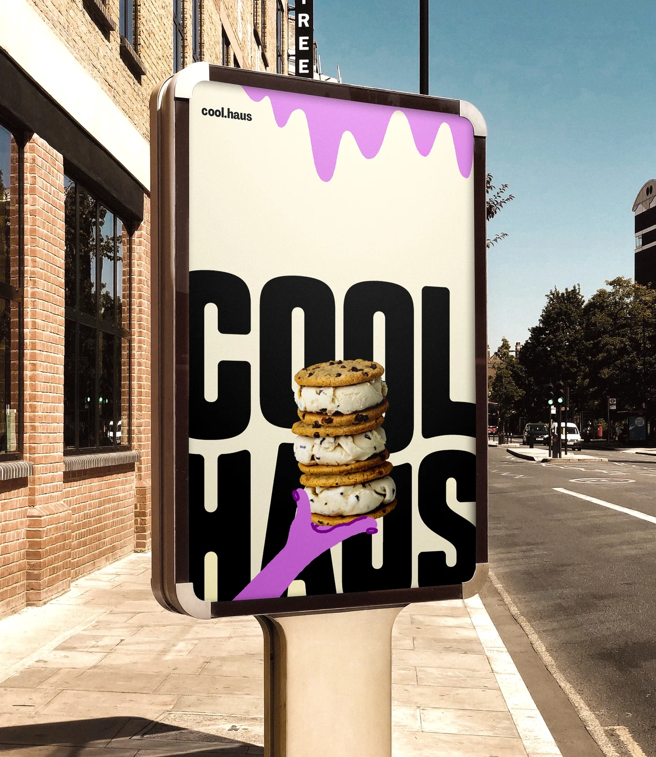 Vertical street advertising panel displays a giant black Coolhaus wordmark, lilac drips and an illustrated hand holding a stack of ice cream sandwiches.