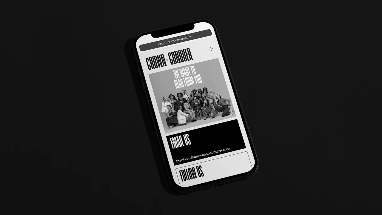 Smartphone on black showing the Crown + Conquer mobile site: We Want to Hear From You over a black-and-white team photo, with Email Us and Follow Us sections.