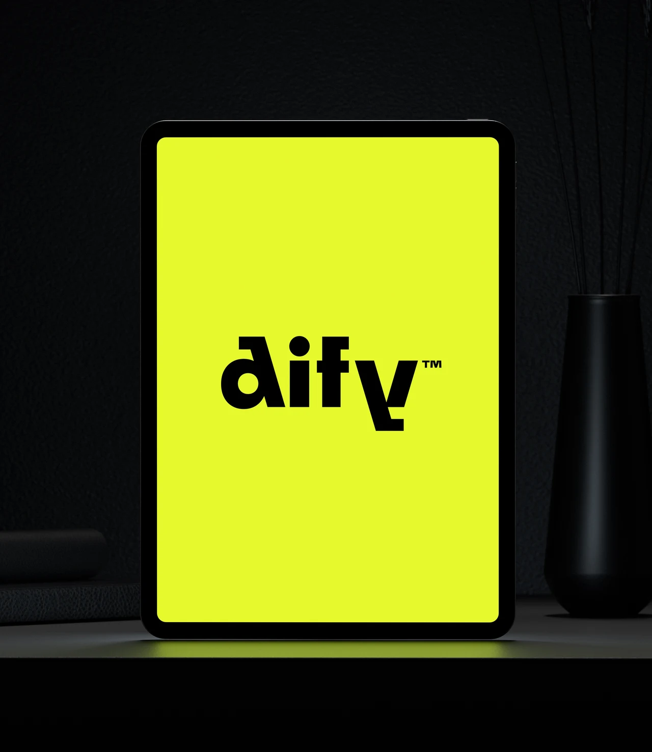 A vertical tablet displays only a black Dify logo on a lime-yellow screen in a dark setting.