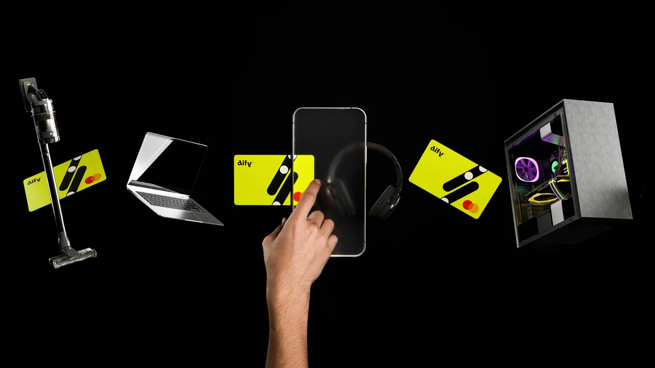 A hand touches a phone surrounded by yellow Dify cards, a laptop, headphones, a vacuum and a desktop computer floating on black.