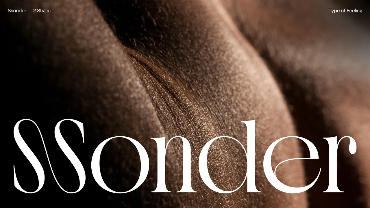 Sonder name in white serif lettering, featuring an expressive initial ligature, over a close photograph of skin with strong light and shadow.