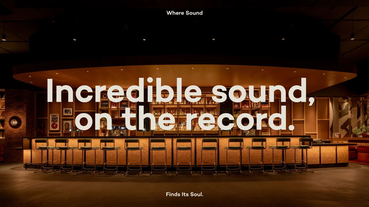 Website banner reading Incredible Sound, on the Record over the warmly lit bar with high stools, framed by Where Sound… Finds Its Soul.