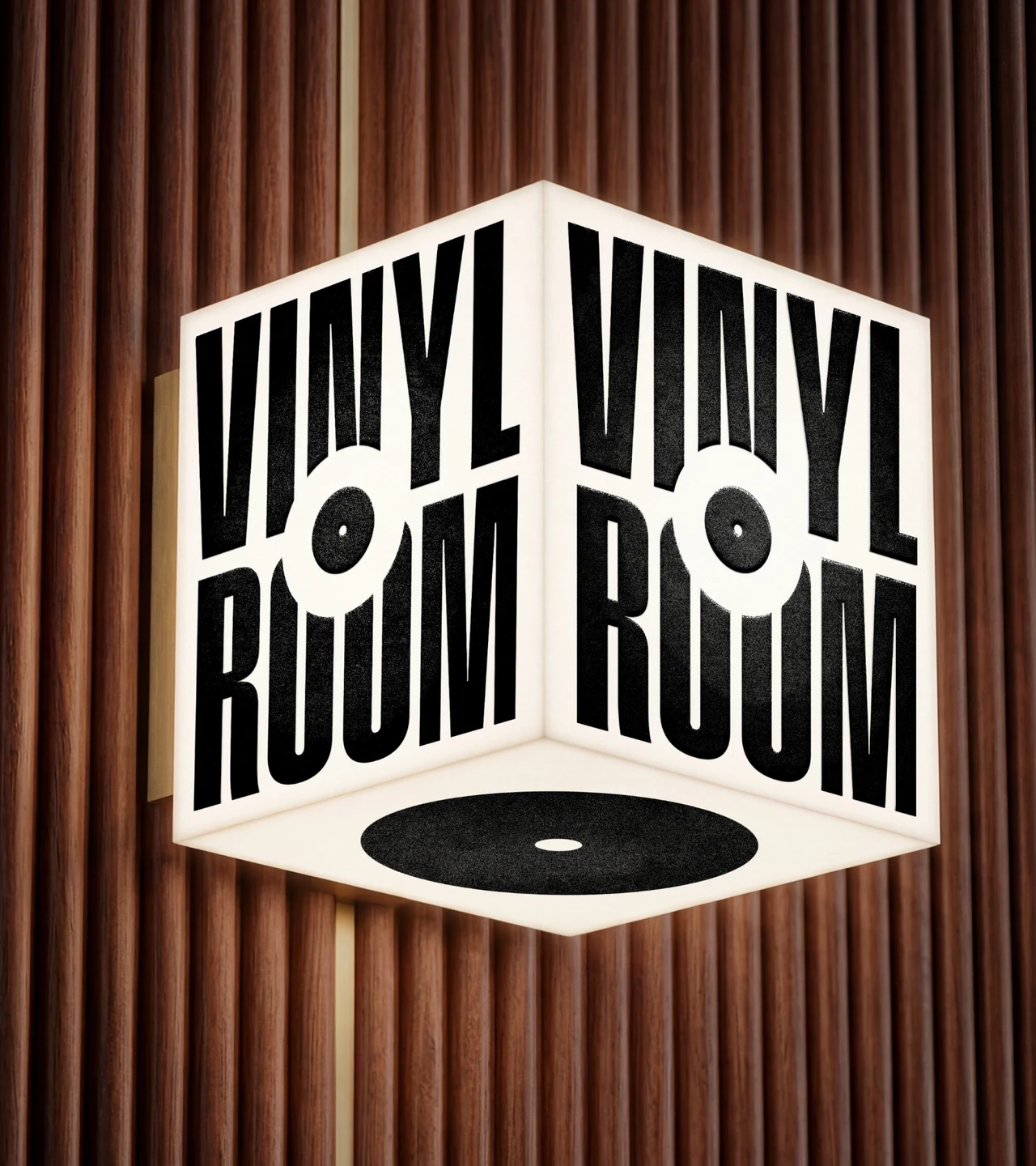 Illuminated cube sign on a fluted wood wall, with the black condensed VINYL ROOM wordmark on two faces, its O drawn as a record, and a record on the base.